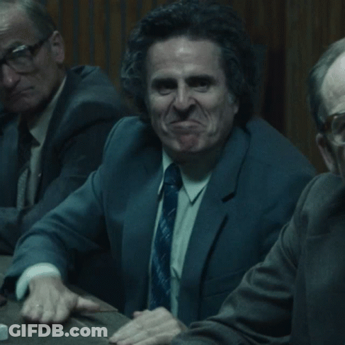 Man In Suit And Tie Making Funny Face GIF
