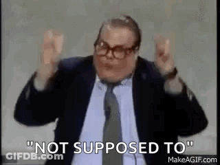 Man In Suit And Tie Making Funny Face GIF
