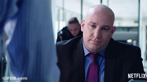 Man In Suit And Tie Netflix Logo GIF