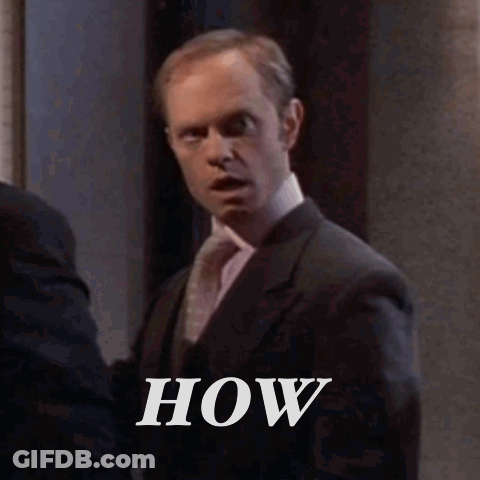 Man In Suit And Tie Next To Another Man GIF