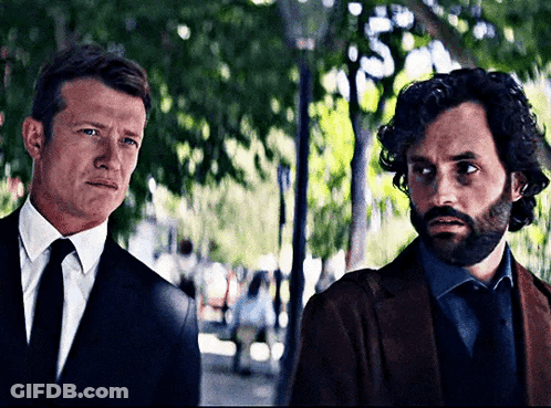 Man In Suit And Tie Next To Another Man GIF