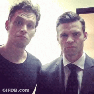 Man In Suit And Tie Next To Another Man GIF