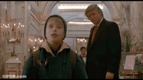 Man In Suit And Tie Next To Boy In Hat GIF