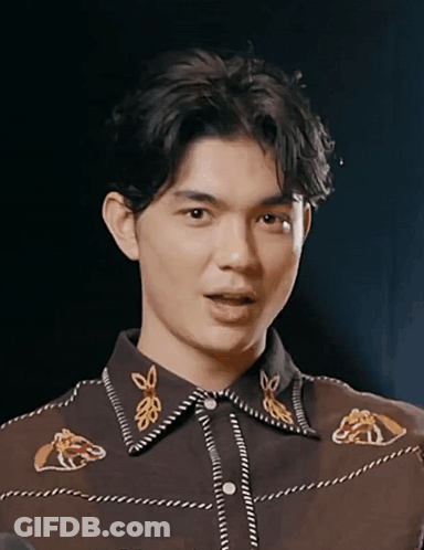 Man In Suit And Tie Next To Car Looking At Camera GIF