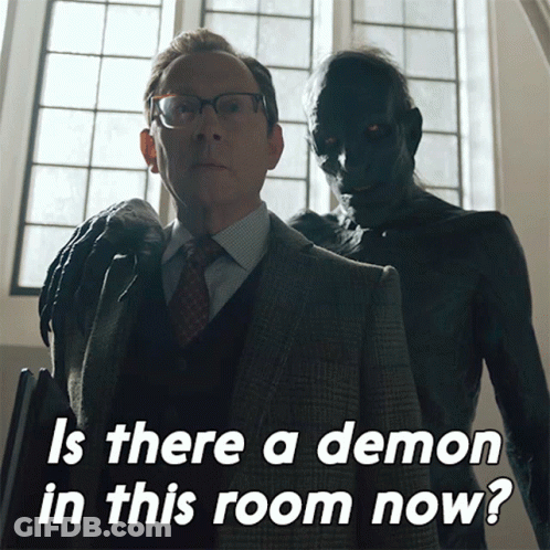Man In Suit And Tie Next To Demon GIF