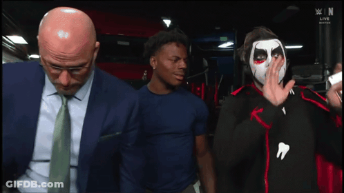 Man In Suit And Tie Next To Face Painted Man With You GIF