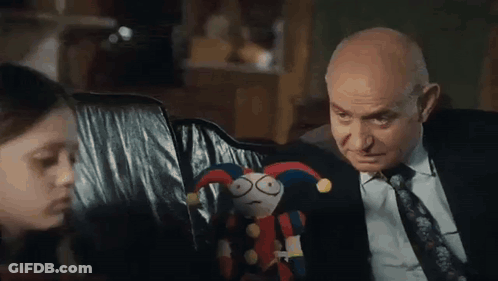 Man In Suit And Tie Next To Girl Holding Stuffed Animal GIF