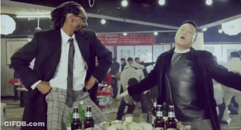 Man In Suit And Tie Next To Man In Black Jacket GIF