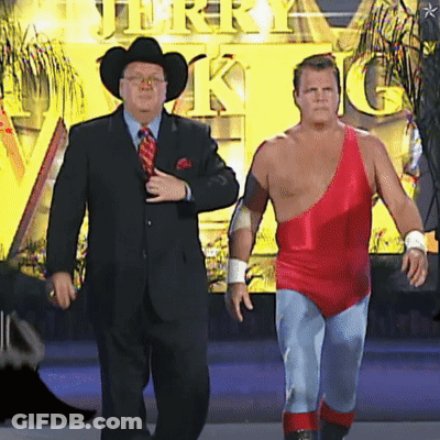 Man In Suit And Tie Next To Man In Red One Piece GIF