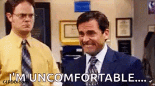 Man In Suit And Tie Next To Man In Yellow Shirt GIF