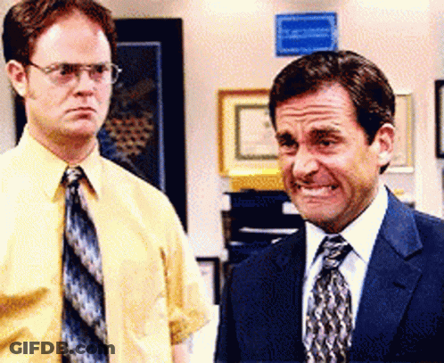 Man In Suit And Tie Next To Man In Yellow Shirt GIF