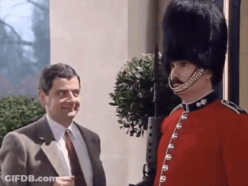 Man In Suit And Tie Next To Military Man GIF