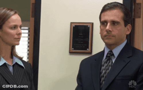 Man In Suit And Tie Next To Woman GIF