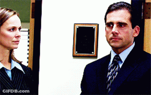 Man In Suit And Tie Next To Woman GIF