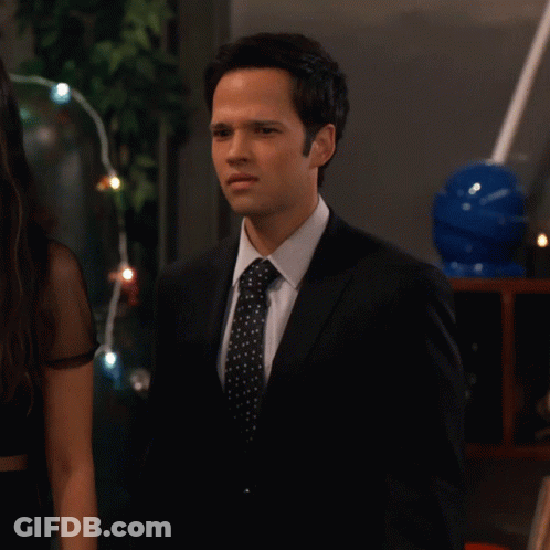 Man In Suit And Tie Next To Woman GIF