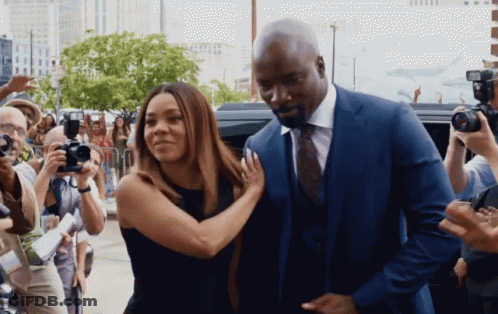 Man In Suit And Tie Next To Woman GIF