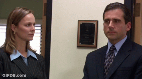 Man In Suit And Tie Next To Woman GIF