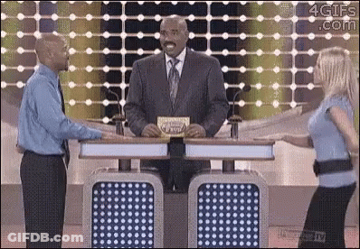 Man In Suit And Tie Next To Woman In Blue GIF