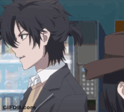 Man In Suit And Tie Next To Woman In Brown Hat GIF