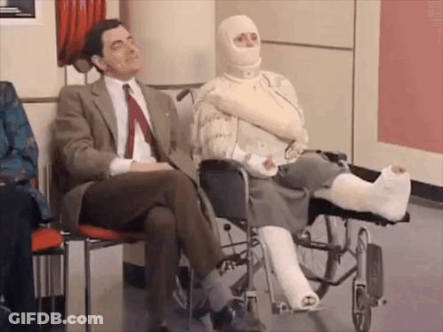 Man In Suit And Tie Next To Woman In Wheelchair GIF