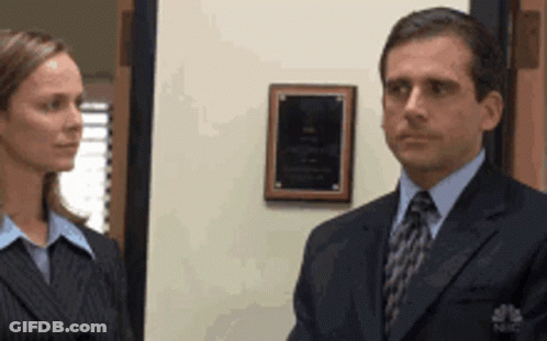 Man In Suit And Tie Next To Woman GIF