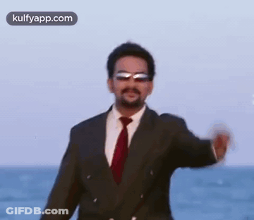 Man In Suit And Tie On Beach GIF