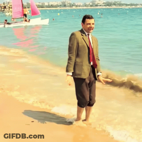 Man In Suit And Tie On Beach GIF