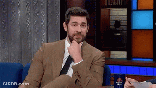Man In Suit And Tie On Chair GIF