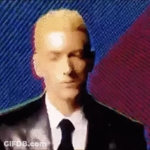Man In Suit And Tie On Colorful Background GIF