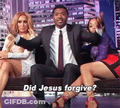 Man In Suit And Tie On Couch With Two Women Did Jesus Forgive GIF