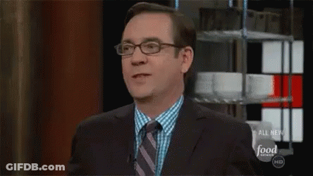 Man In Suit And Tie On Food Network GIF
