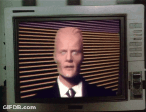 Man In Suit And Tie On Monitor GIF