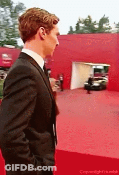 Man In Suit And Tie On Red Carpet GIF