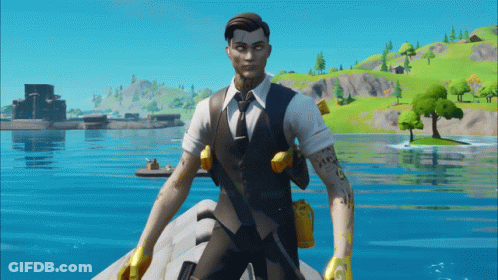 Man In Suit And Tie On Rock By Water GIF