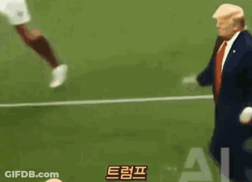 Man In Suit And Tie On Soccer Field GIF