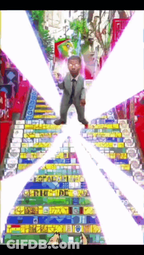 Man In Suit And Tie On Stairs GIF