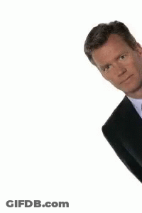 Man In Suit And Tie Peeking GIF
