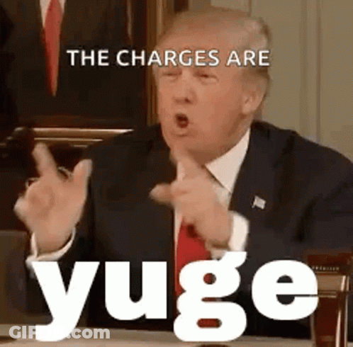 Man In Suit And Tie Pointing At Desk GIF