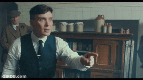 Man In Suit And Tie Pointing GIF