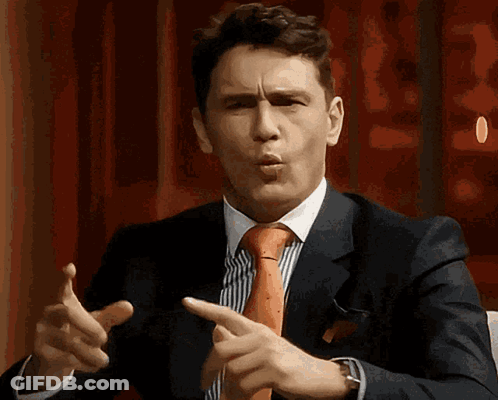 Man In Suit And Tie Pointing GIF