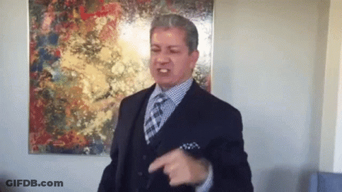 Man In Suit And Tie Pointing GIF