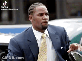 Man In Suit And Tie Posing By Car GIF