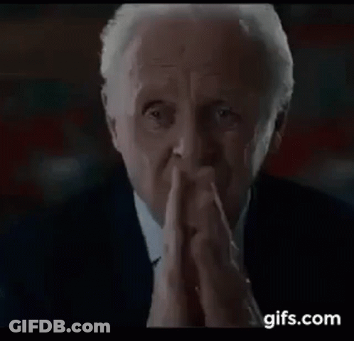 Man In Suit And Tie Praying With Hands Folded GIF