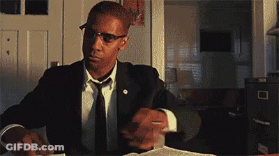Man In Suit And Tie Reading Book GIF