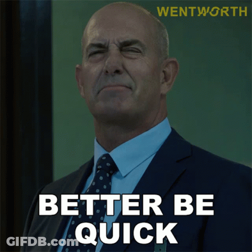 Man In Suit And Tie Saying Better Be Quick GIF