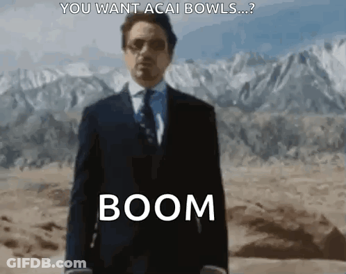 Man In Suit And Tie Saying Boom In Desert Mountains GIF