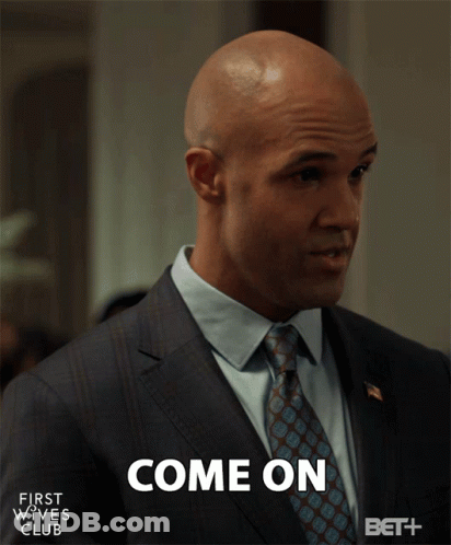 Man In Suit And Tie Saying Come On GIF