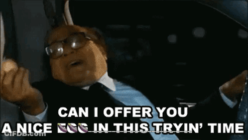 Man In Suit And Tie Saying Egg In Trying Time GIF