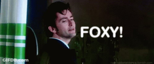 Man In Suit And Tie Saying Foxy GIF