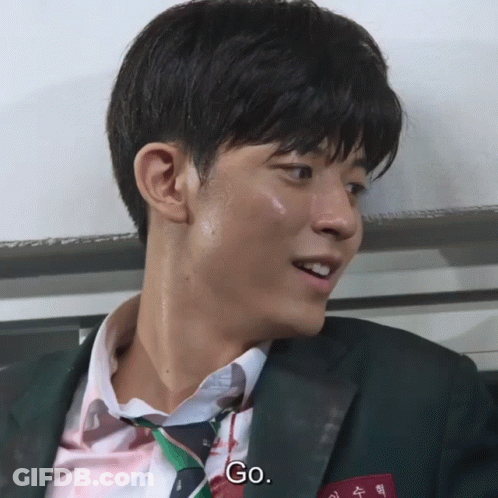 Man In Suit And Tie Saying Go GIF